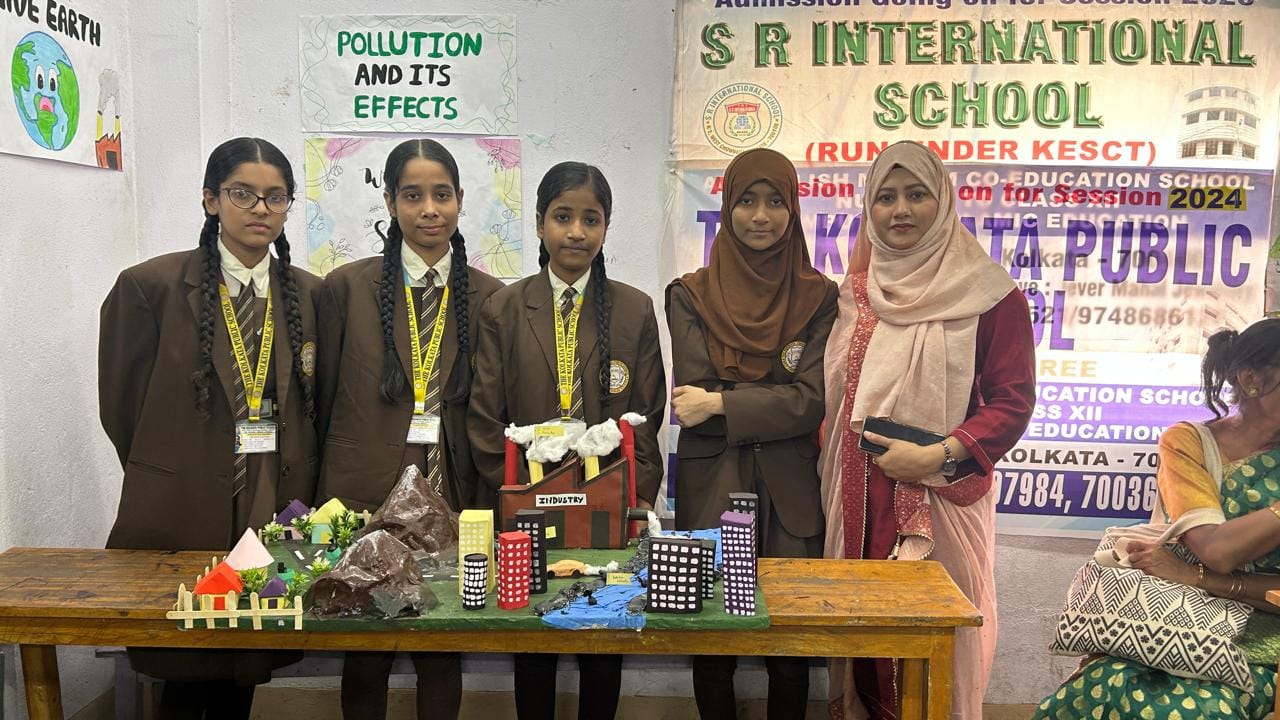 Students presenting a science exhibition model